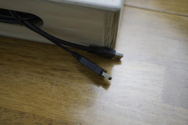 USB cords tucked into soapbox